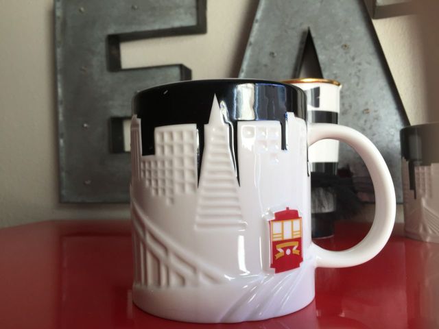 I love the relief mugs with the strong contrast between the navy and white and the single full color icon on each one. Of course they picked the cable car. 